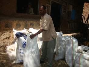 Solomon carrying bags of rice
