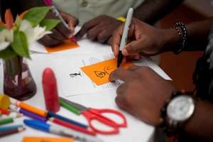 A guest drawing a self-portrait