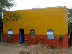 Casita with exterior paint and landscaping.