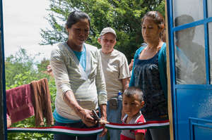 Maria and her family receiving her new home.