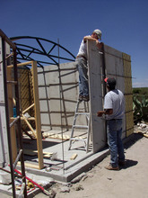 Volunteers constructing a new house