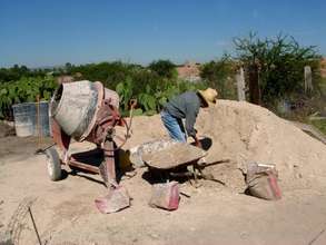 The recipient helping to start a new casita.