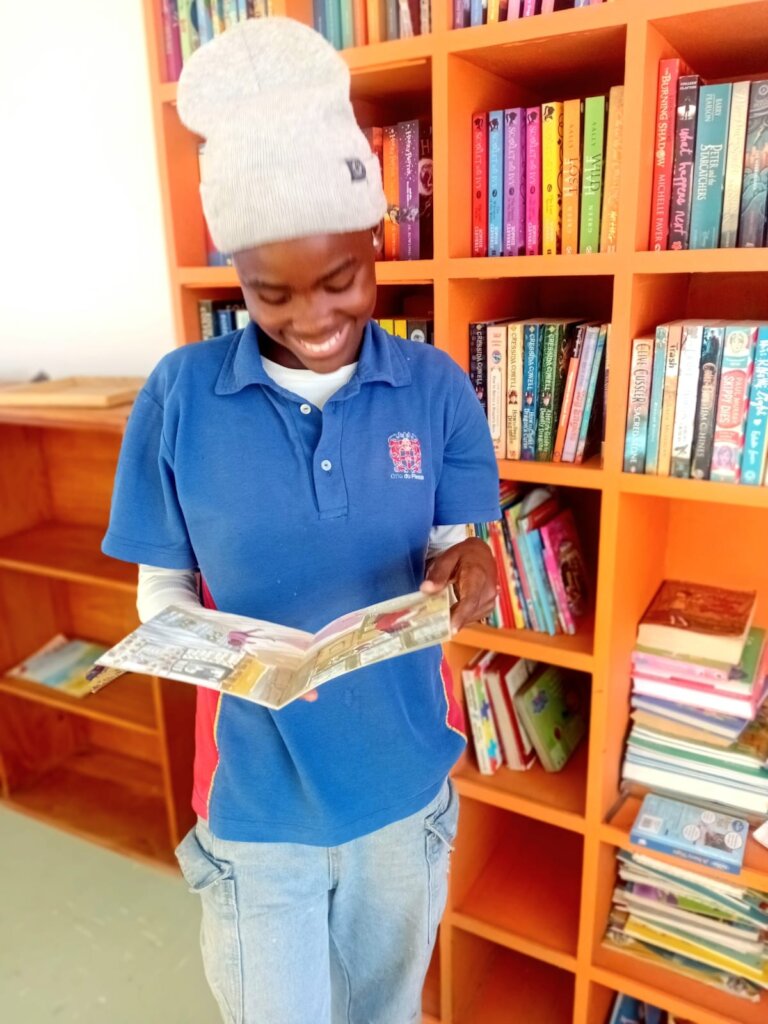 Anesipho in her happy place - the library!