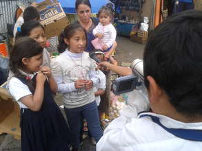 Children making a video about their life and work