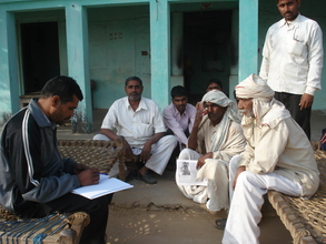 Documenting Orans_KRAPAVIS staff among community