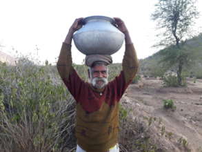 Pastoralist with milk pot; milk product to sell