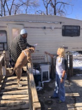 This senior and her dog live in this camper.