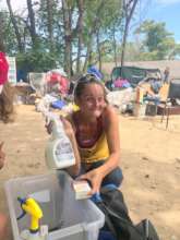 Homeless person getting flea spray!