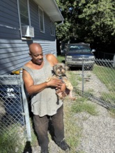 Ronald loves his tiny Yorkie mix, Teenie!