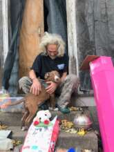 This man and his dog live in an abandoned house.