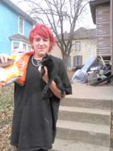 Giving cat supplies to this homeless young man.