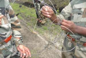 Forest officials with recovered snares