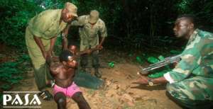 A wildlife trafficker arrested by a forest patrol