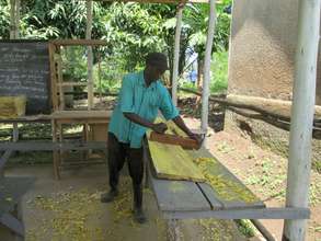 KIRUCODO Volunteer working on the timber