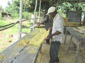 KIRUCODO Volunteers working on timber for hives