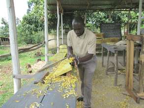Executive Director working on the timber for hives