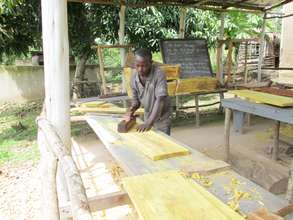 KIRUCODO Volunteers working on timber for hives