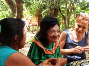 Our two health workers attending to an elder