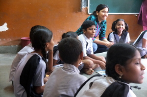 Apni Shala Co-Founder, Amrita with children