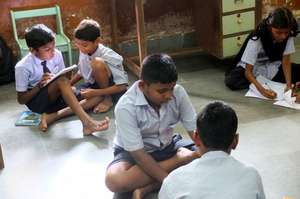 Children collaborate on a task