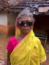 Kajri in front of her home