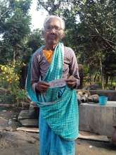 Saroni Soren infront of her home