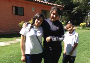 Luisa (center) empowered in her new role.