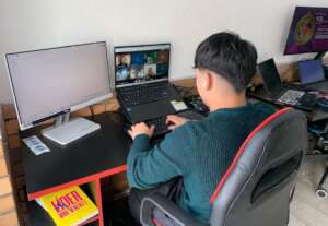 Young student connected to his remote work