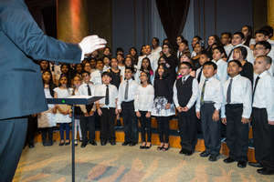 Students singing confidently and proudly.
