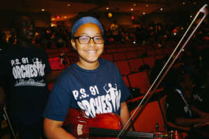 An orchestra player cheers! Credit: Daniel Pagan