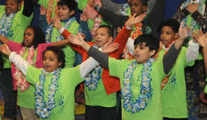 Students sing in an elementary school chorus.