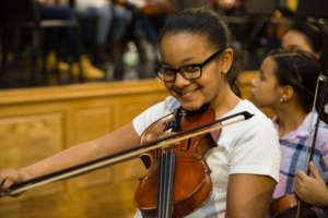 An orchestra student poses after a concert!