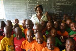 Teacher Caroline and some of her P2 students