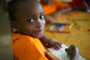 a second grader enjoying an art activity