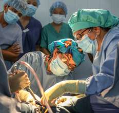 Dr. Dhanda training while performing surgery
