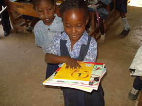 A happy child with her textbooks