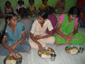 More girls enjoying their dinner.