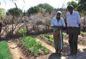 Mr. and Mrs. Dube with their garden