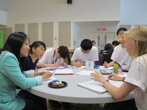 Group of OSC students work together with a mentor.