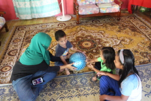 Hammad participating in group play