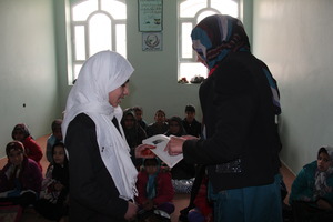 A teacher trained by AIL working with a student