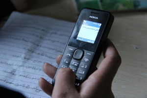 A Women Takes Part in the Mobile Literacy Course