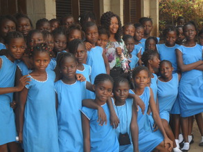 Juliana in group photo with girls at FAWE lab
