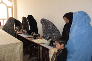 Women Using New Sewing Machines