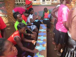 Learning to make their own hygiene kits