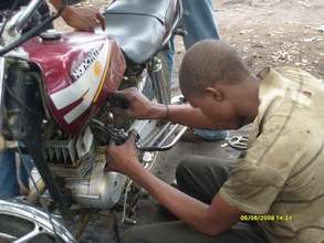 Abubakar Hassan learning to work on a cycle