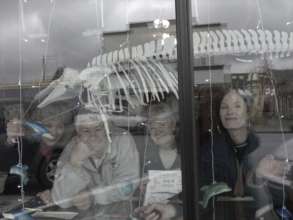Happy volunteers and Maxine in Whale Center window