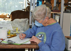 Sandy Dubpernell filling out necropsy form