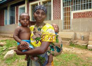 Tanzanian mother with her twin boys