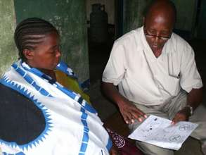Mother reviews pictorial directions for misoprosto
